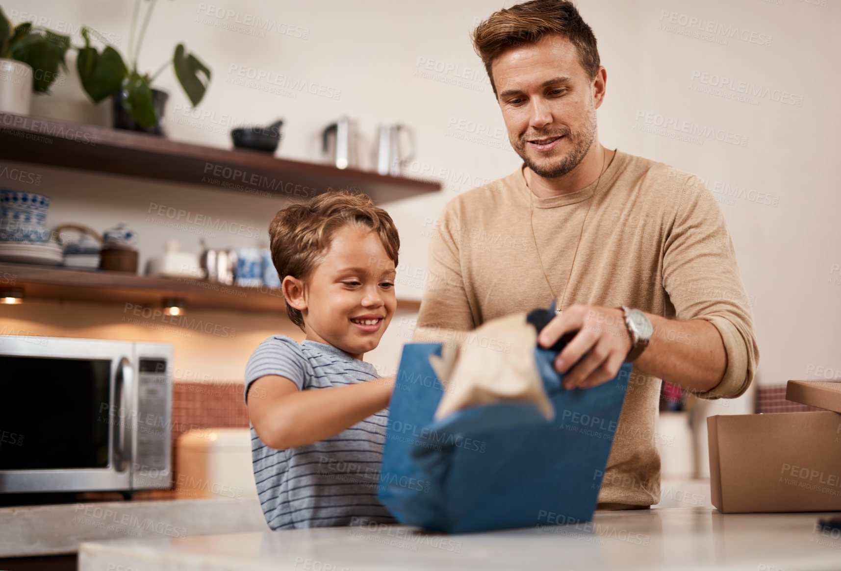 Buy stock photo Father, boy and happy in home for birthday, gift and surprise with box, smile and fun celebration. Dad, son and family in apartment for bonding, development and giving present with package together  