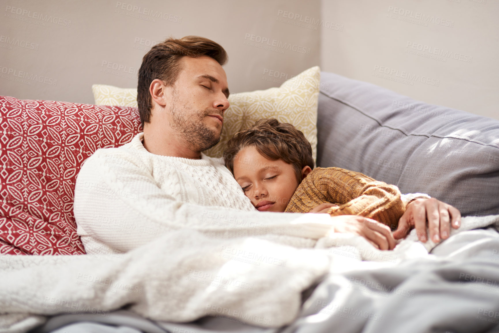 Buy stock photo Father, son and sleeping in home for tired, bonding and relax with blanket, pillow and peace on sofa. Dad, boy and fatigue on couch for development, support and resting with nap, asleep and dream