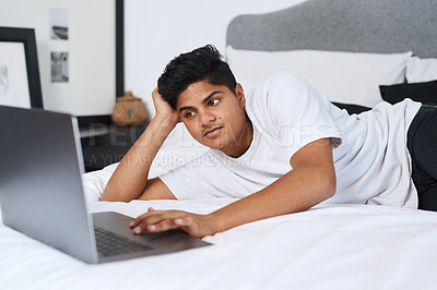 Buy stock photo House, bedroom and man with laptop, relax and network with connection, online game and typing. Apartment, person or guy with computer, resting and comfort wit break, website info or entertainment