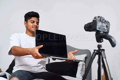 Buy stock photo Happy man, influencer and camera for laptop review for video recording, online streaming or content creation. Indian teenager, tech vlogger or young streamer with equipment for live broadcast in home