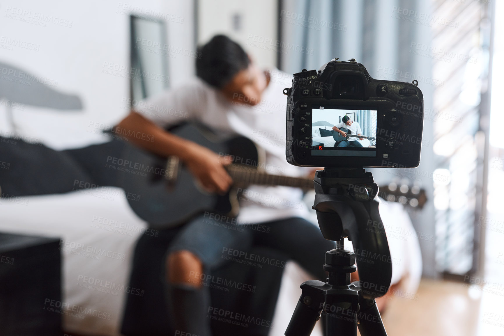 Buy stock photo Camera, influencer and man with guitar in home for live streaming, music vlog and social media. Content creator, musician and person with musical instrument for talent, performance or creative skills