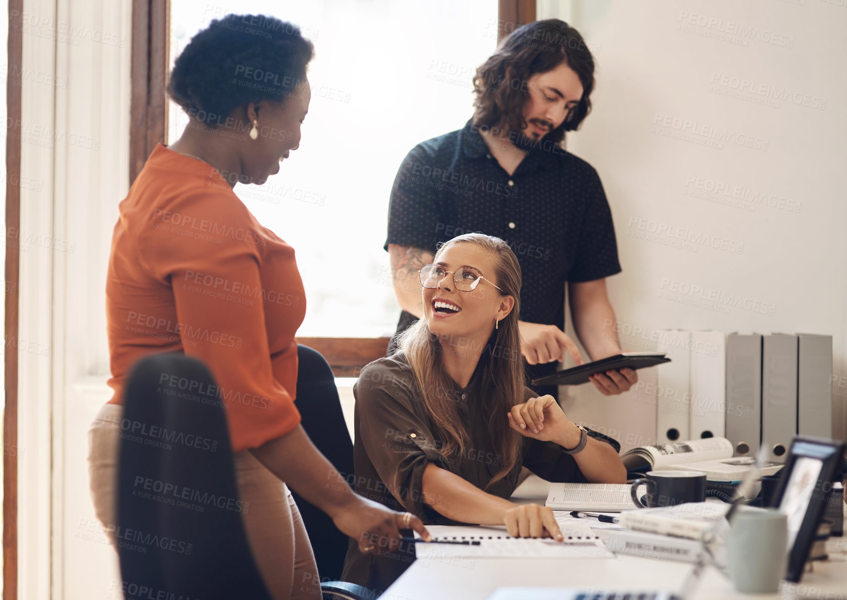 Buy stock photo Shot of a group of businesspeople working together in an office