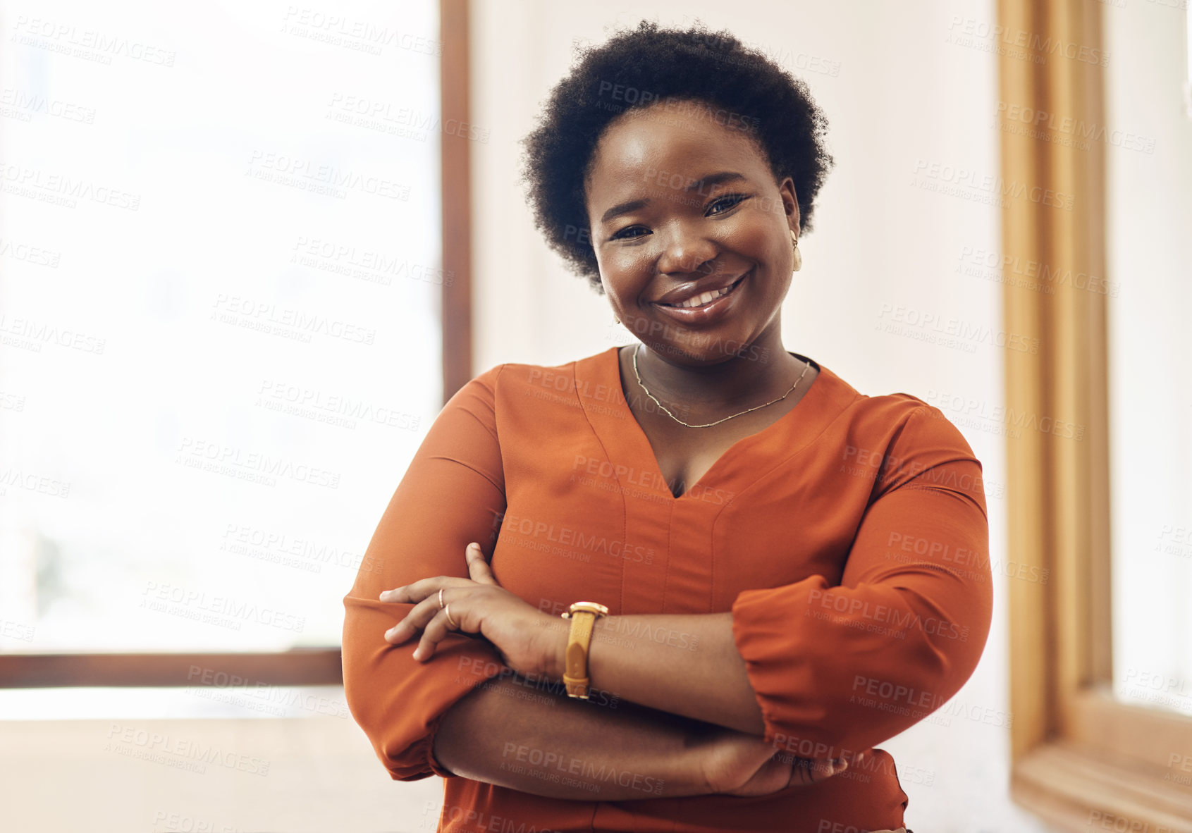Buy stock photo Portrait of smiling, friendly casual african american business woman leader, standing confident with arms crossed in modern office. Cheerful professional female designer working in startup company