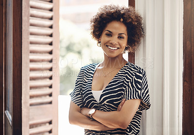 Buy stock photo Smiling real estate agent looking motivated, ambitious and confident with arms crossed in new listing, rental or property. Portrait of afro woman ready to sell new house, negotiate a loan or mortgage
