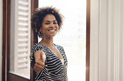 Buy stock photo Portrait of a young businesswoman showing thumbs in a modern office