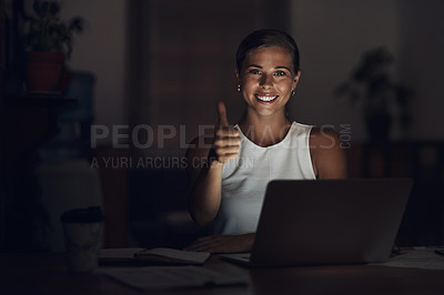 Buy stock photo Portrait of a young businesswoman using a laptop and showing thumbs up during a late night at work