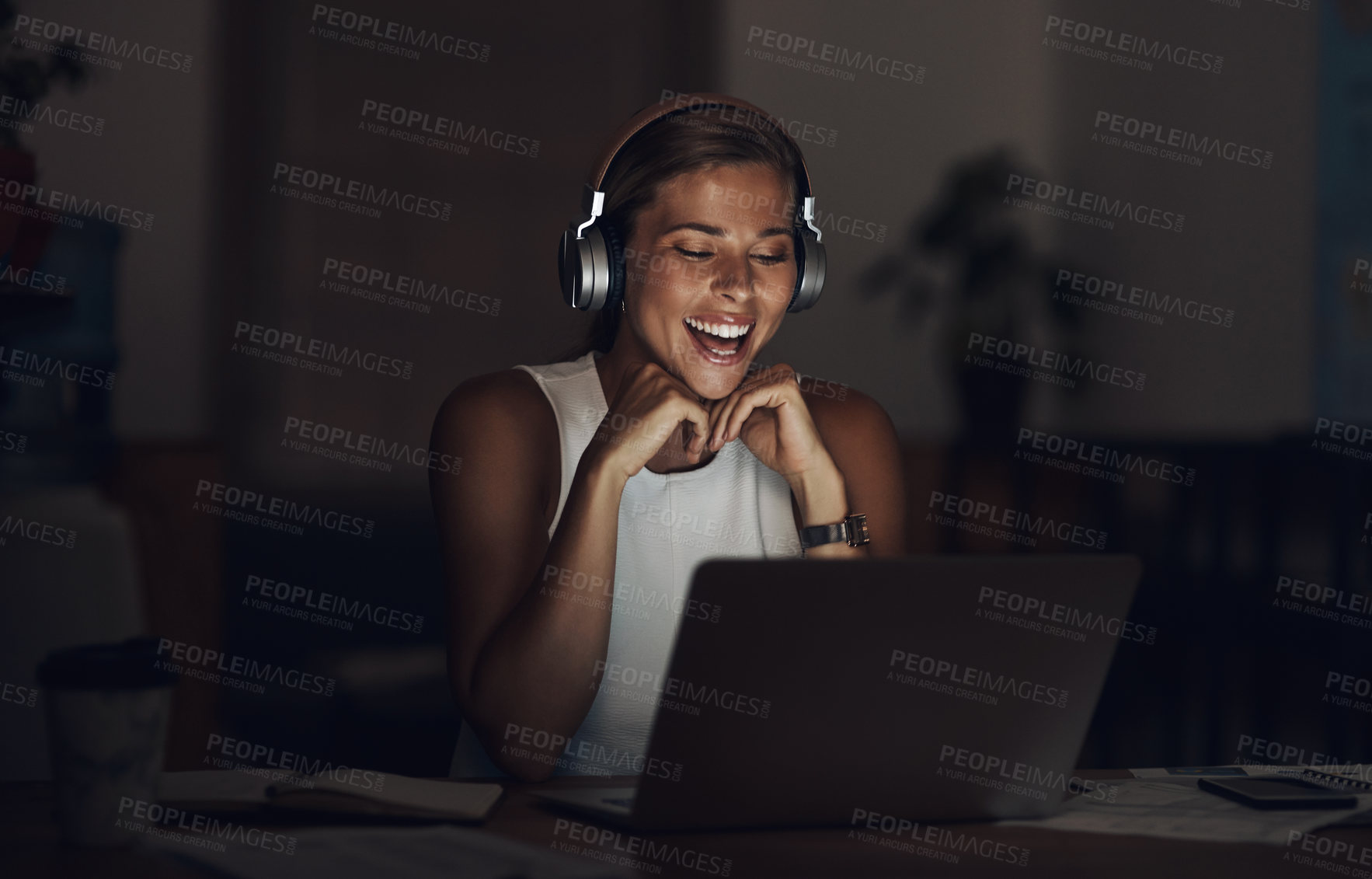 Buy stock photo Business, night and woman with laptop, headphones and smile with internet, funny and laughing. Person, employee and consultant with headset, evening and computer with happiness, humor and laughing