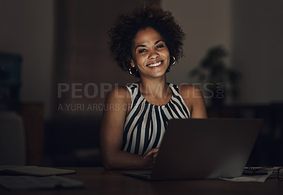 Buy stock photo Portrait of a young businesswoman using a laptop during a late night at work