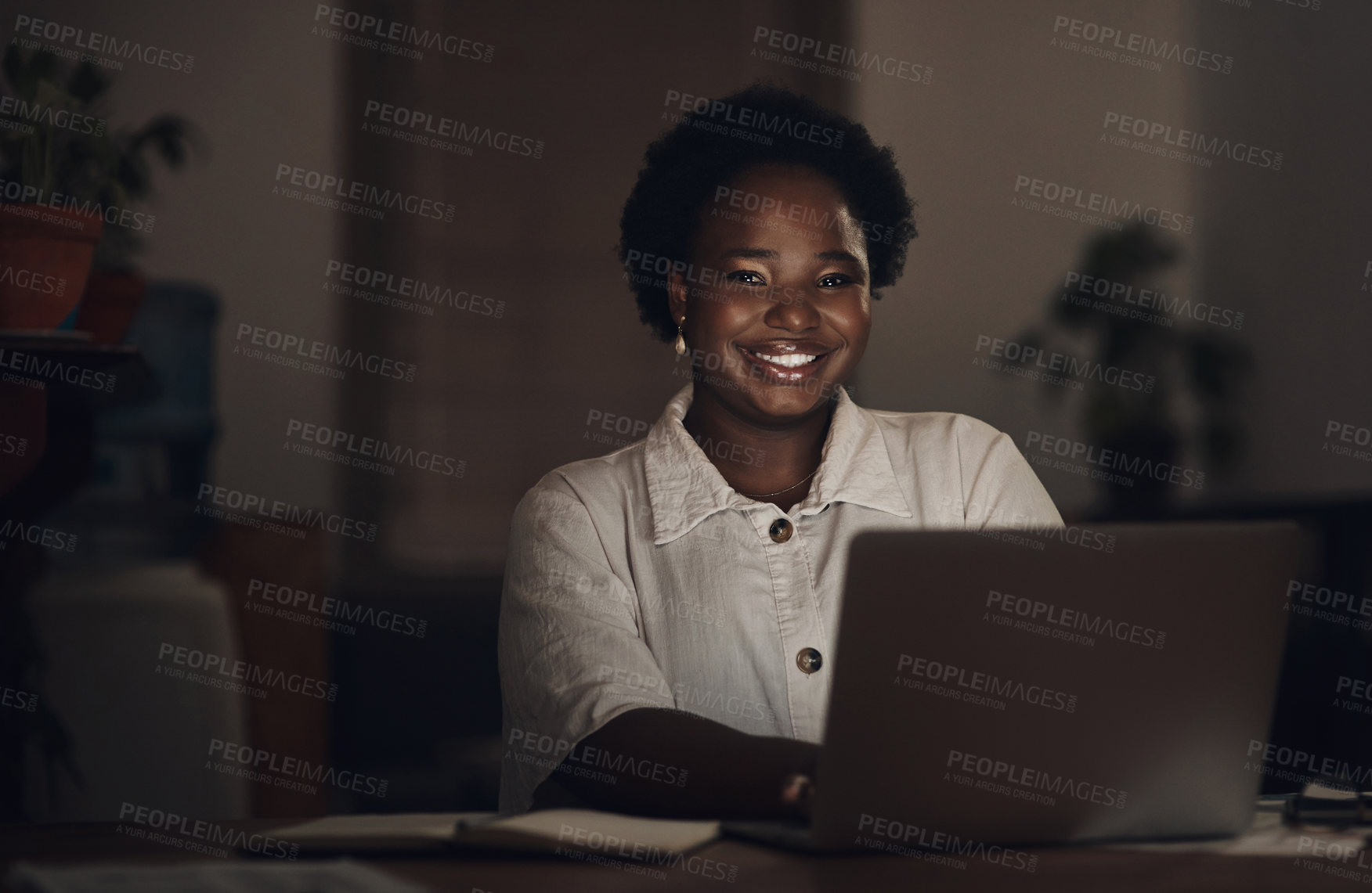 Buy stock photo Portrait of a young businesswoman using a laptop during a late night at work
