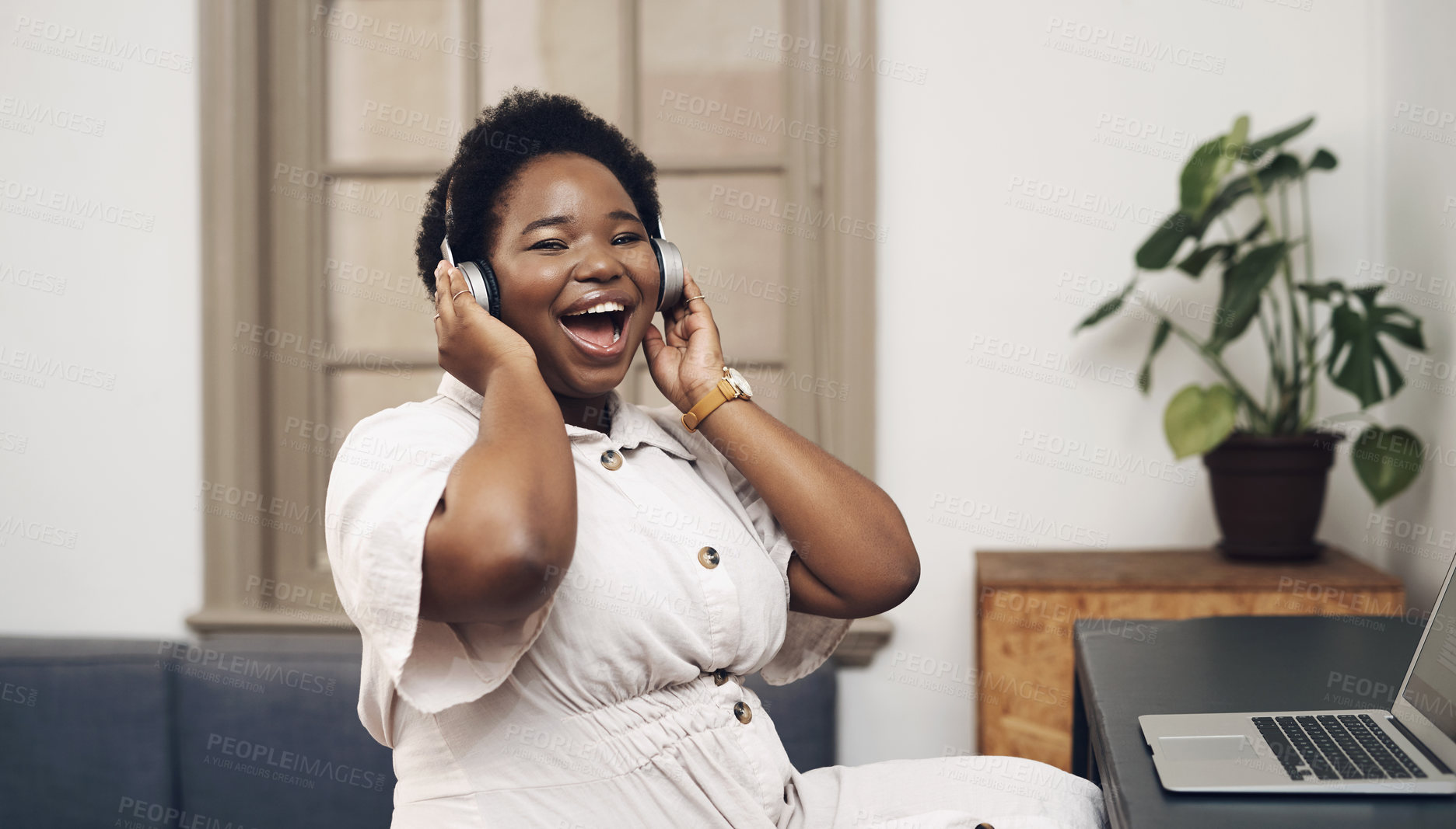 Buy stock photo Black woman, headphones and employee portrait in office, streaming song and copywriter with laptop. Female person, podcast inspiration and listening to sound in creative workplace, laugh and energy