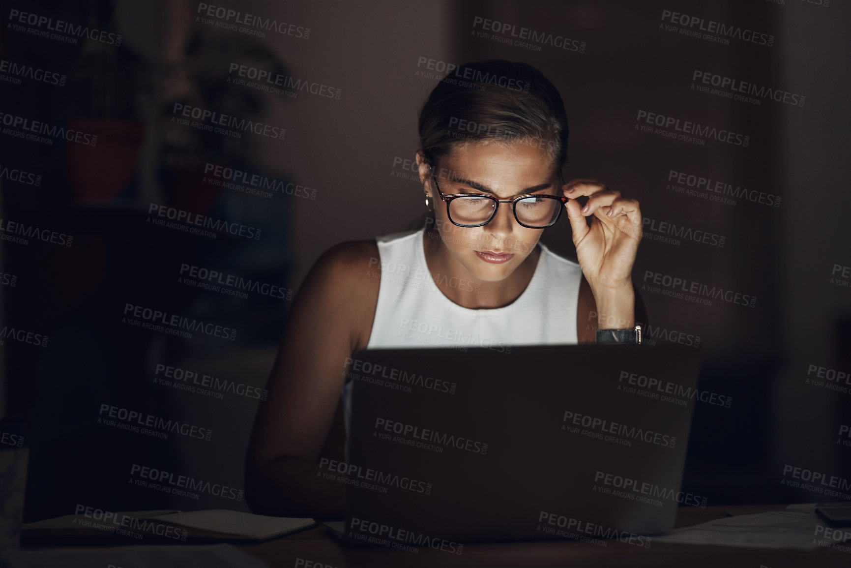 Buy stock photo Business, woman and reading laptop at night for checking stock market review, financial investment and serious. Professional, trader and glasses with problem solving for NFT trading or inflation news