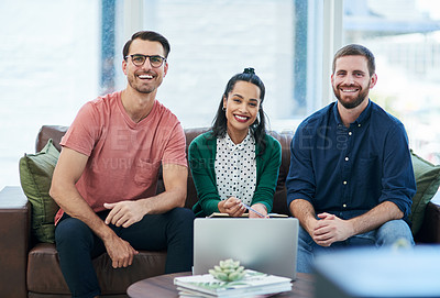 Buy stock photo Portrait of a group of young businesspeople using a laptop together in a modern office