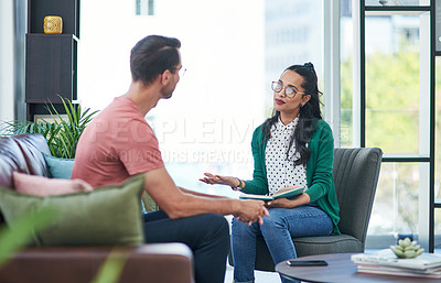 Buy stock photo Mental health, therapy or counseling with a woman psychologist and male patient talking in her office. Psychology, wellness and trust with a female doctor or shrink consulting a man for healing