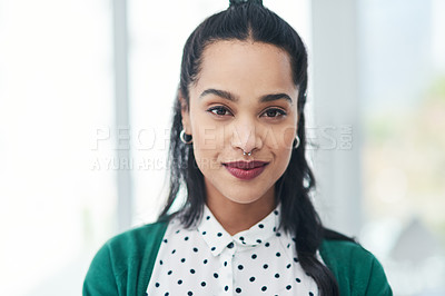 Buy stock photo Portrait of a confident young businesswoman working in a modern office