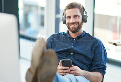 Buy stock photo Headphones, portrait and businessman in office with relax listening to music, radio or podcast online. Happy, audio tech and male designer streaming song, playlist or album on internet in workplace.