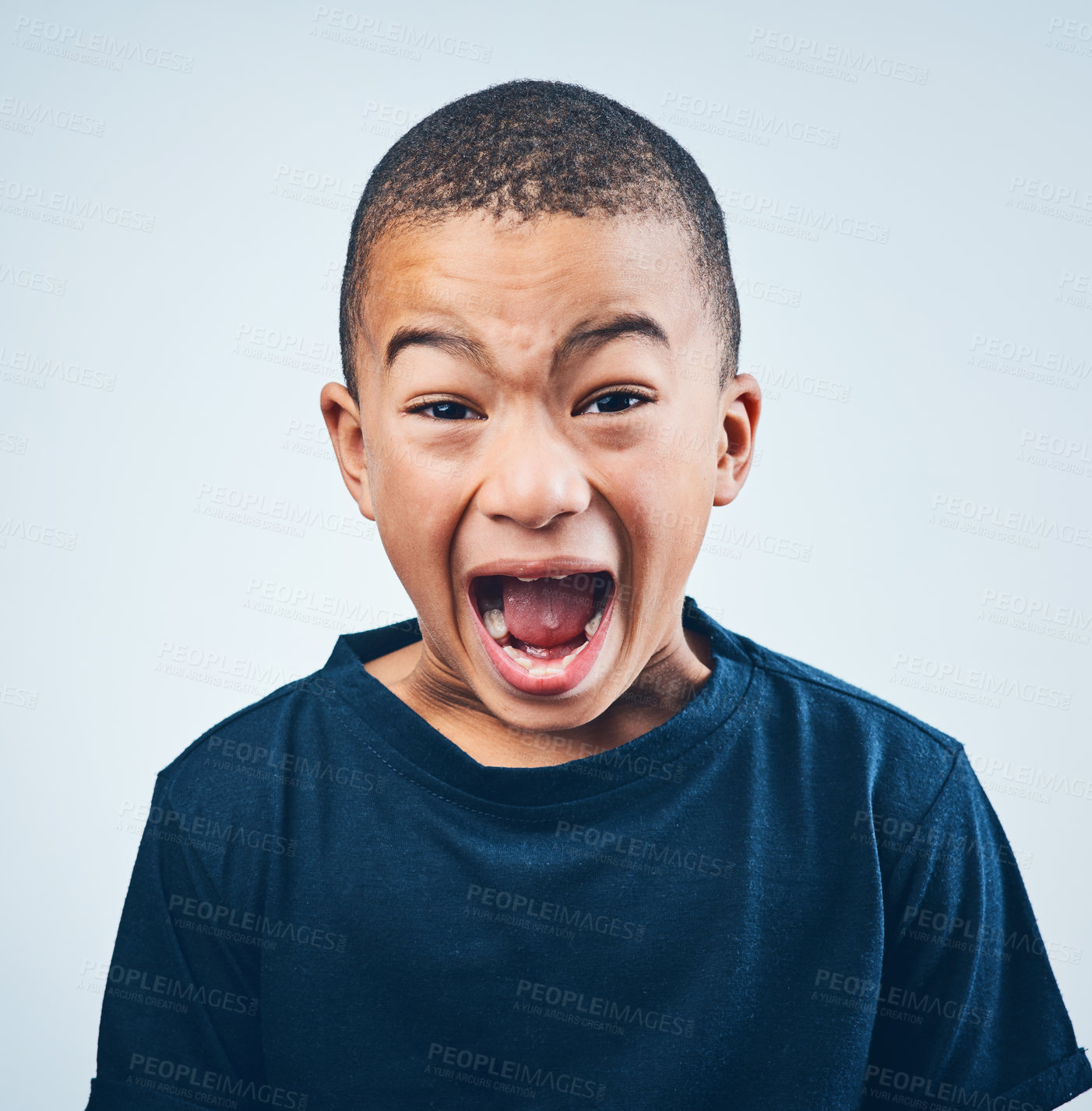 Buy stock photo Studio shot of a cute little boy playfully screaming against a grey background
