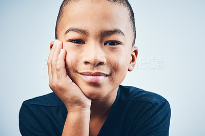 Buy stock photo Studio shot of a cute little boy posing against a grey background