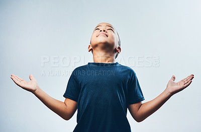 Buy stock photo Praying, religion and child with faith, studio and boy with trust in holy spirit, belief and hope. White background, hands and worship for guidance, devotion and blessings of God and mindfulness