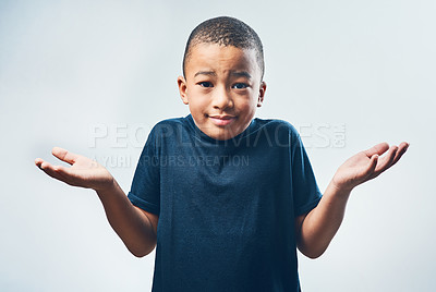 Buy stock photo Shrugging, doubt and portrait of a child with a decision isolated on a white background in a studio. Confused, young and a little boy with a gesture for choice, indecision and confusion or uncertain