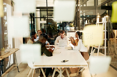 Buy stock photo Professional, creative and casual business people in meeting with laptop, talking and planning a project together in an office at work. Diverse, happy and smiling team of workers discussing strategy