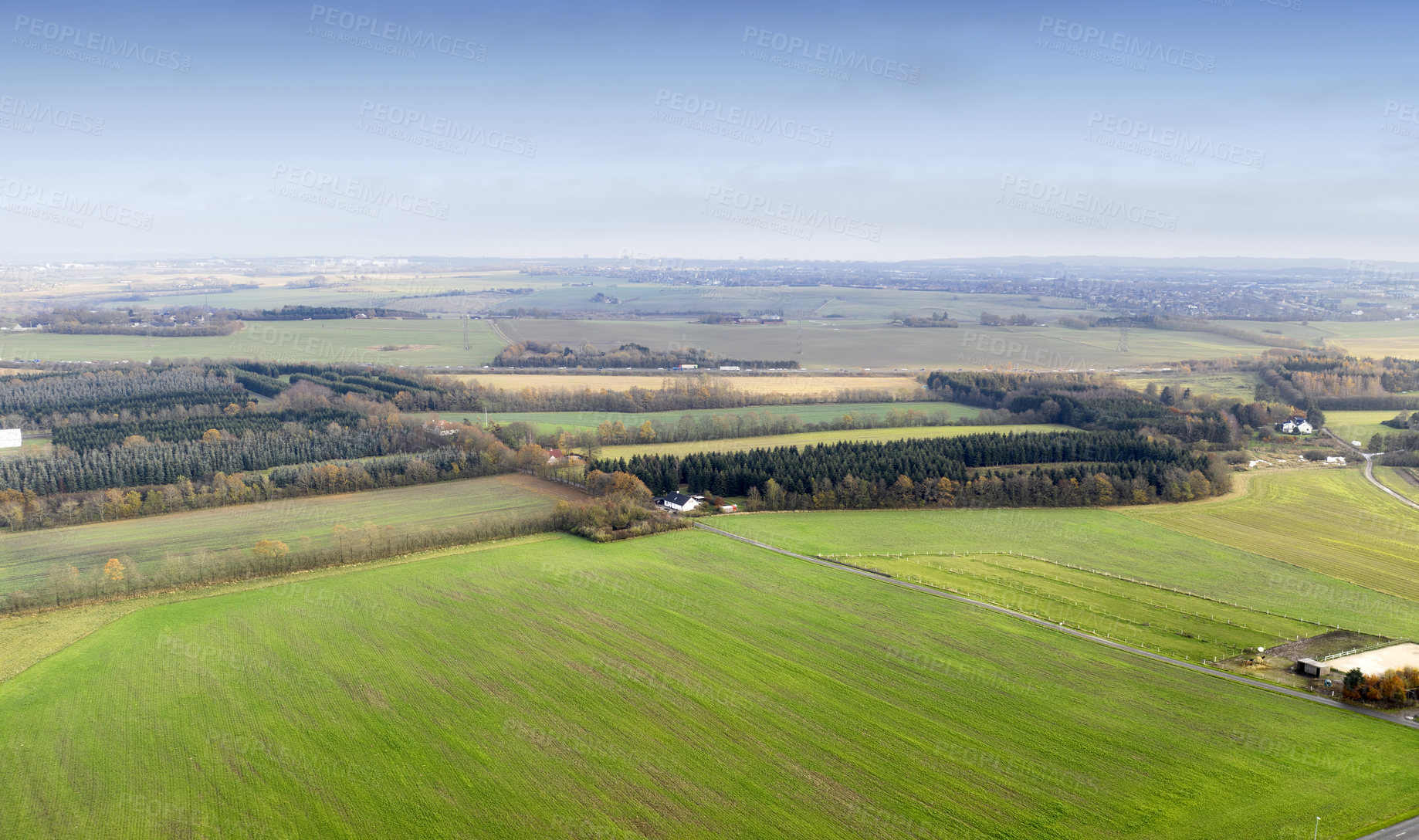 Buy stock photo Landscape aerial view of a farm in the countryside in summer. Agricultural field for farming, cultivation, and harvesting from above. An empty piece of land for vineyards, ranching, and growing crop