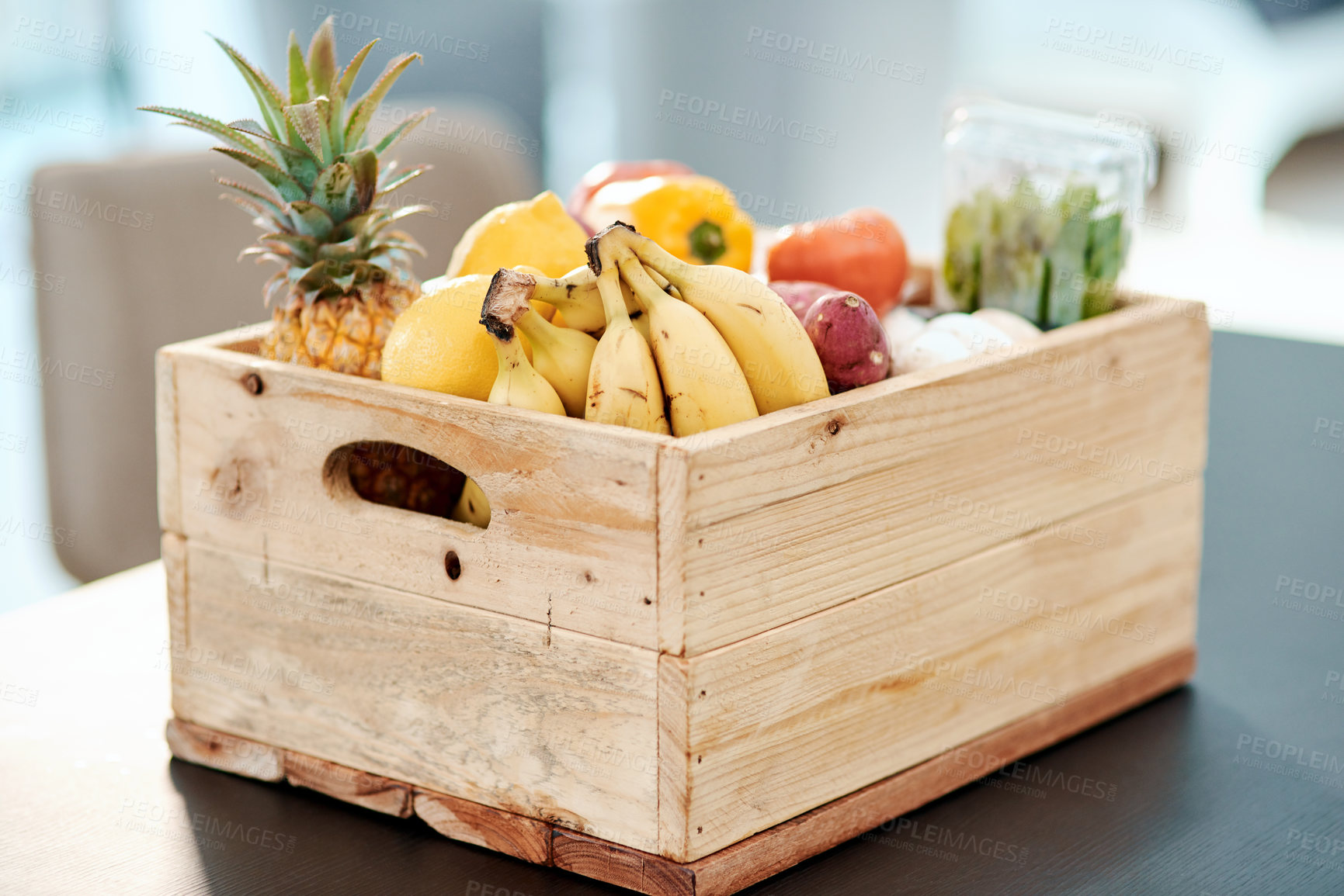 Buy stock photo Box, fresh and grocery with fruit on kitchen counter of supermarket delivery, organic food and nutritionist choice. Container, healthy product and ecommerce order, diet ingredients and stock at house