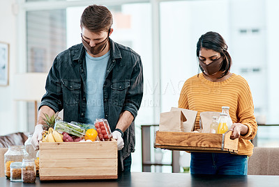 Buy stock photo Couple, box and groceries with food delivery at house of online shopping, organic products and unpacking. People, face mask and health policy of ecommerce order, package safety and covid19 compliance