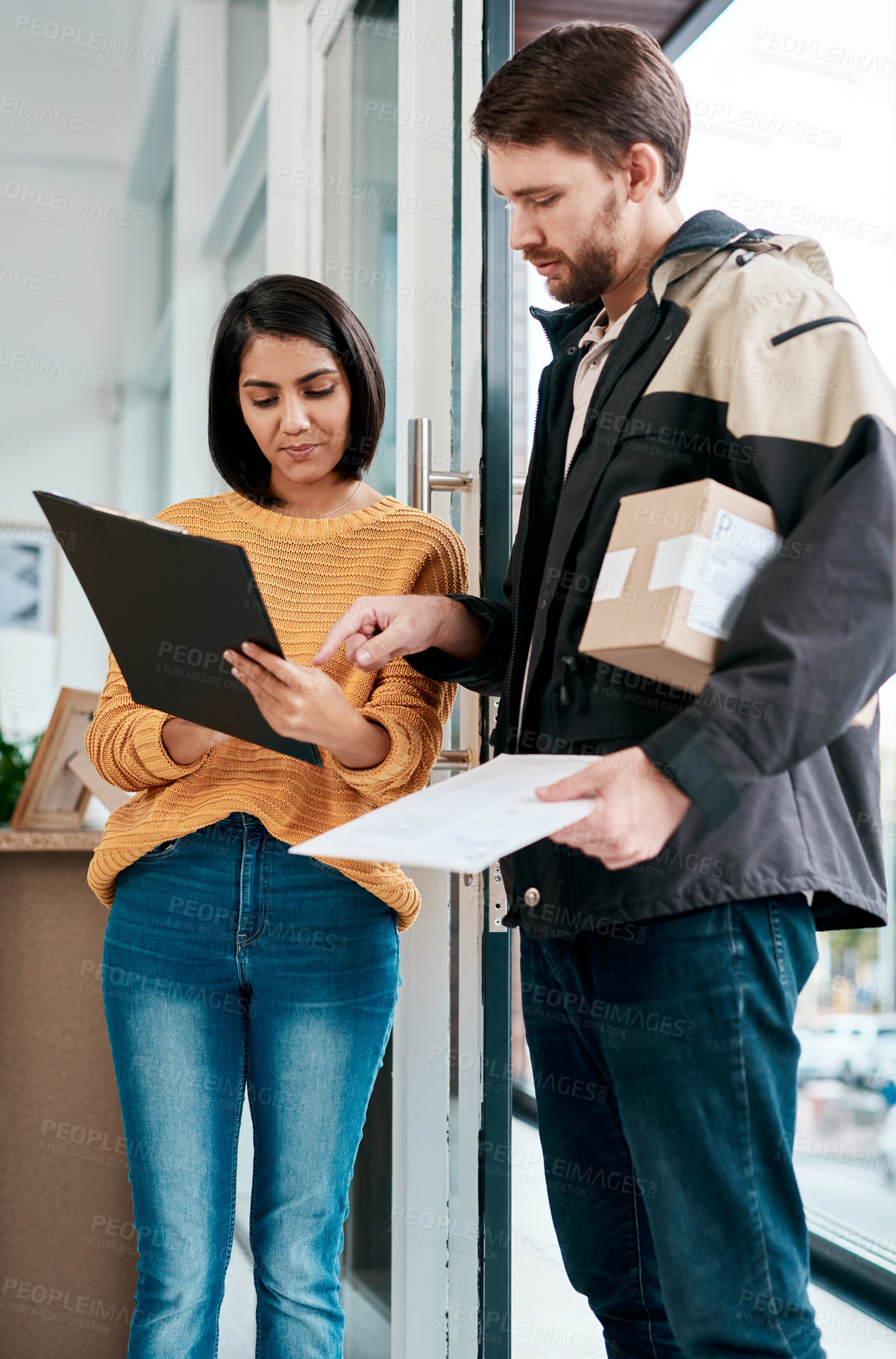 Buy stock photo Delivery man, woman and happy with signature in home for package, parcel and courier. People, clipboard and smile on paperwork as agreement with boxes at front door with online shopping and service