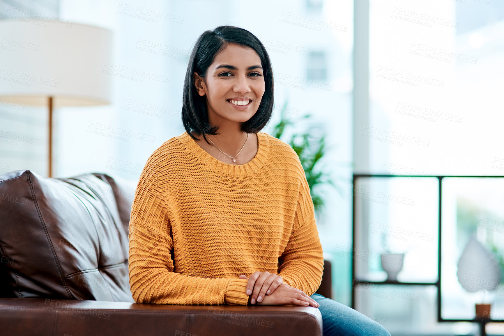 Buy stock photo Portrait, relax and smile of Indian woman on sofa in living room of home for weekend break or rest. Calm, easy and peace with happy person in apartment for morning stress relief, time off or wellness