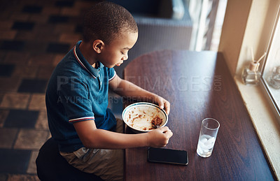 Buy stock photo Shot of a young boy eating a bowl of spaghetti at home