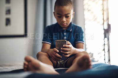 Buy stock photo African child, cellphone and browse on bed for education, app or streaming subscription with movie or video. Boy, smartphone and learning in bedroom with remote schooling, show or cartoon in home