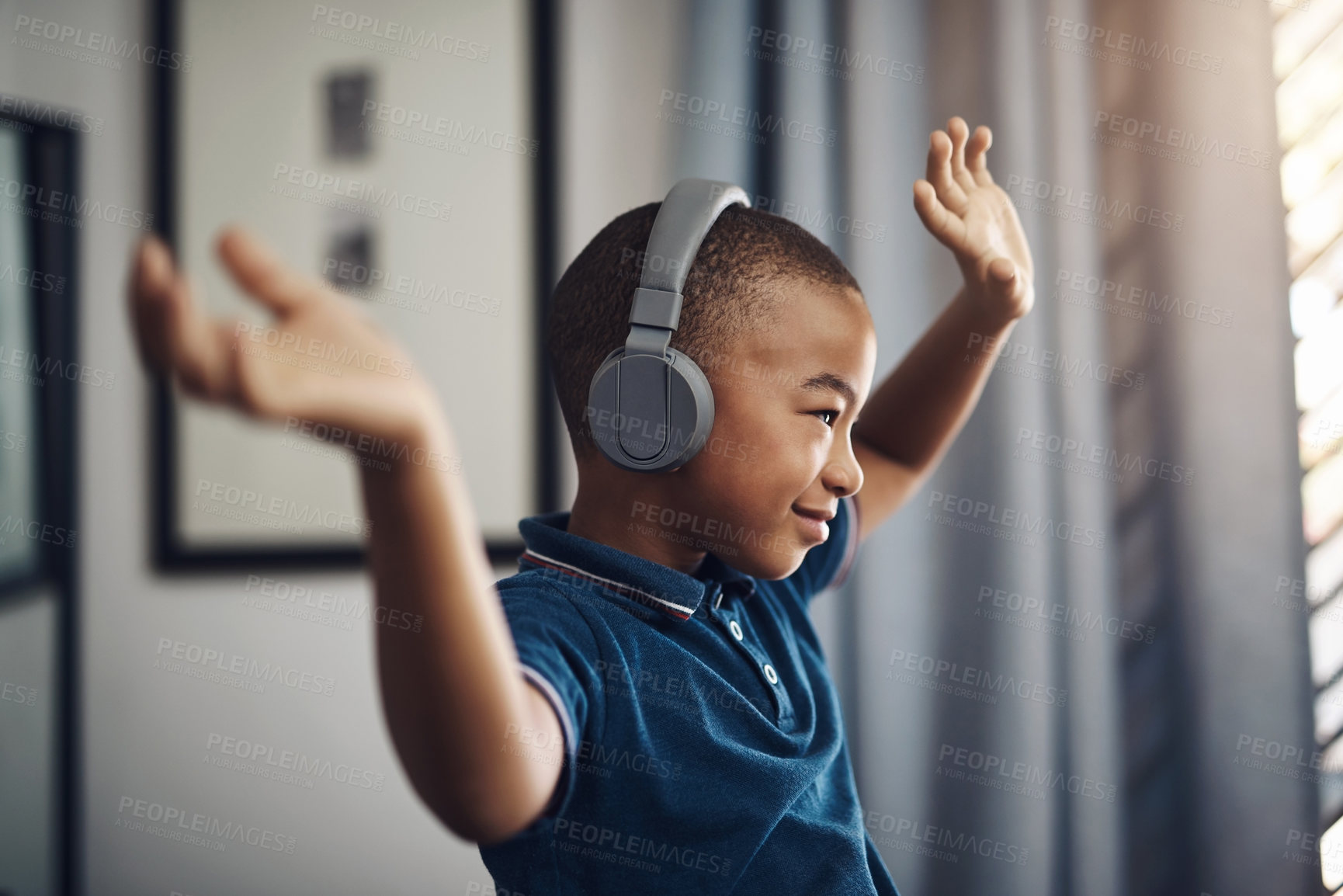 Buy stock photo Boy, home and happy with headphone for streaming music, audio and radio for fun. African person, profile and kid with smile at apartment for subscription, online and website for playlist and album