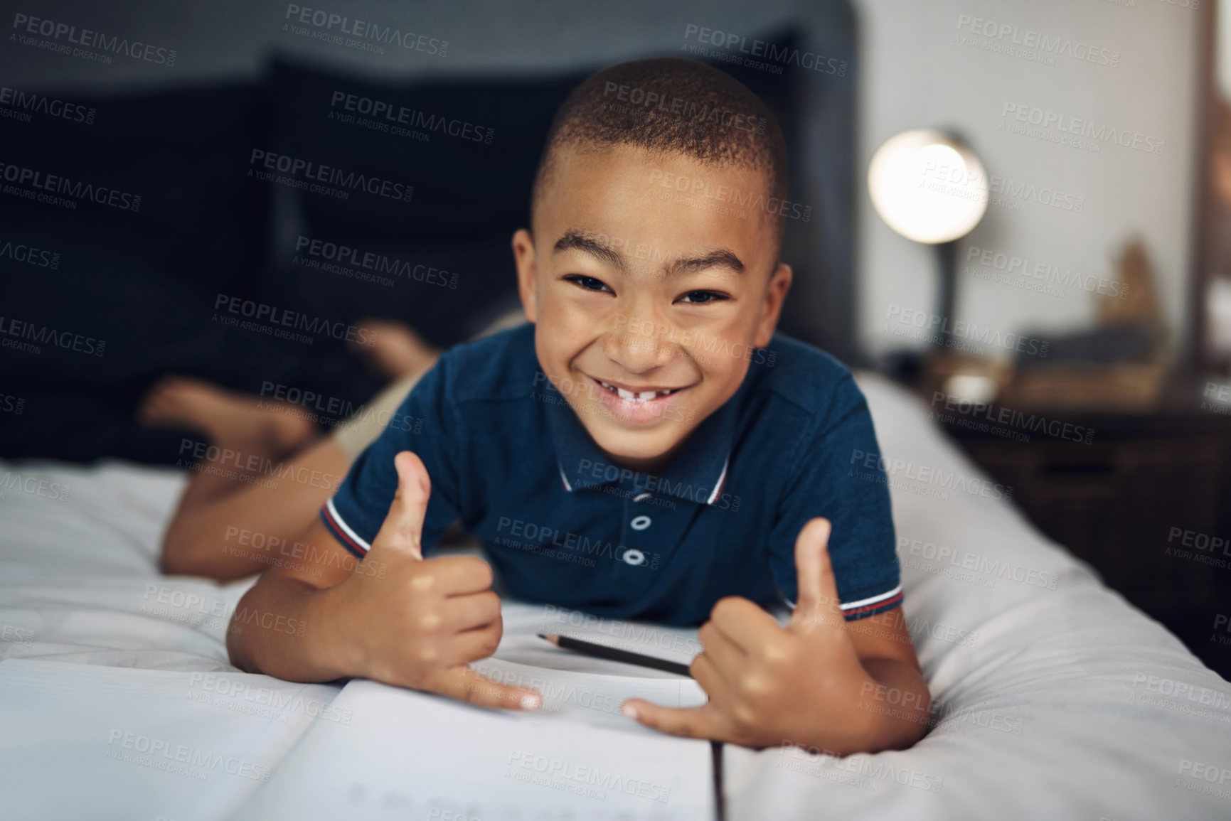 Buy stock photo Happy boy, portrait and relax with book in bed for hang loose, homework or joy for education or learning at home. Young, male person or preteen with smile, gesture or shaka hand sign in bedroom