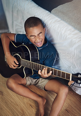 Buy stock photo Music, learning and guitar with kid in bedroom for acoustic, prodigy and jazz performance. Artist, creative and theater with child playing instruments at home for band practice, rock and talent