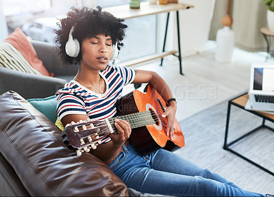 Buy stock photo Woman, music and passion with guitar at home for music, production or hobby performance. Girl, talented artist or acoustic guitarist with musical instrument for sound, song and digital rhythm notes