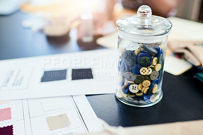 Buy stock photo Shot of sewing buttons in a jar