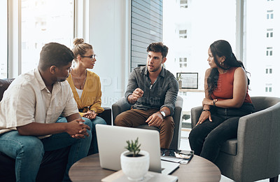 Buy stock photo Shot of a group of businesspeople having a discussion in an office