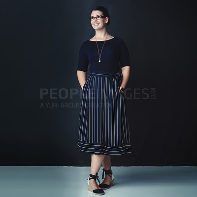 Buy stock photo Studio shot of a corporate businesswoman looking thoughtful against a dark background