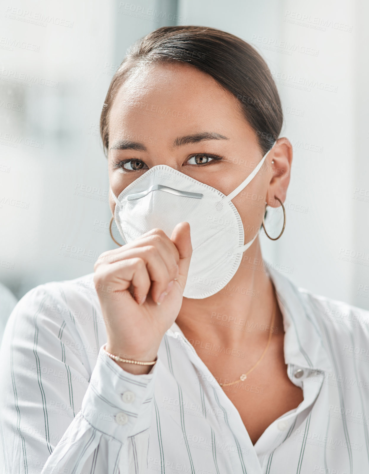 Buy stock photo Shot of a masked young businesswoman coughing in a modern office