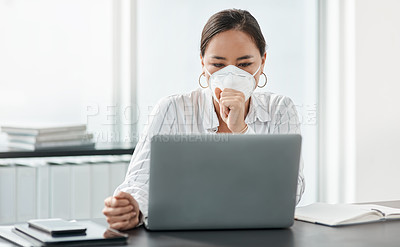 Buy stock photo Shot of a masked young businesswoman coughing while working at her desk in a modern office