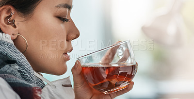 Buy stock photo Shot of a young businesswoman having a glass of herbal tea in a modern office