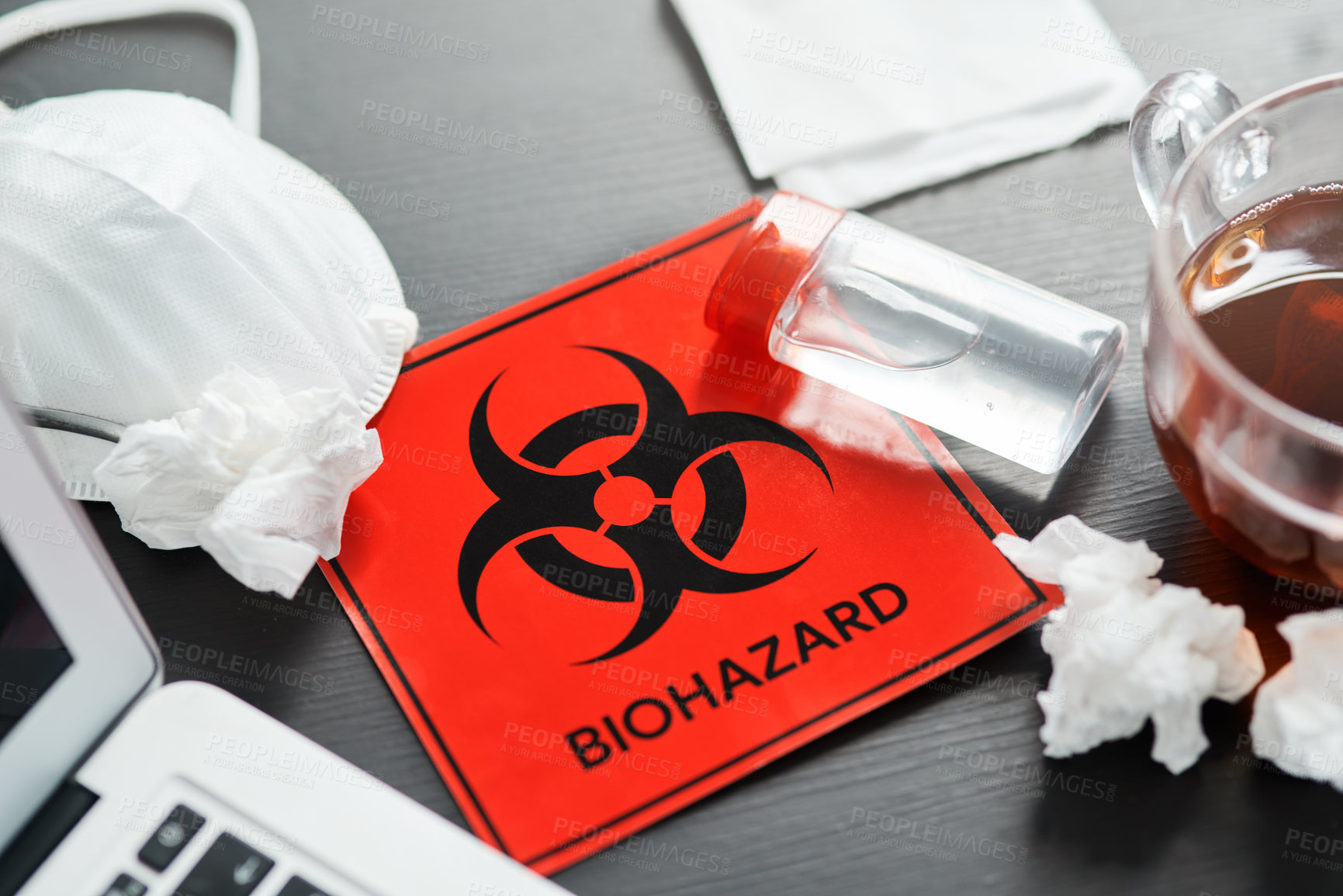 Buy stock photo Shot of a biohazard sign on a workstation