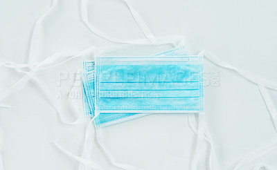Buy stock photo Shot of surgical masks against a white background