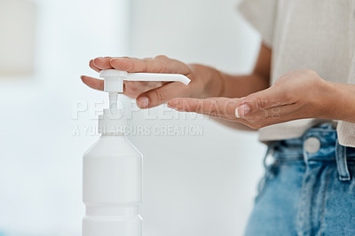 Buy stock photo Cropped shot of an unrecognizable woman sanitising her hands