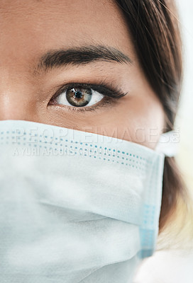Buy stock photo Closeup shot of a woman's eye while wearing a mask on her face