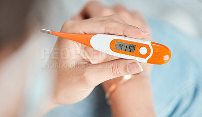 Buy stock photo Shot of a woman holding a digital thermometer that reads 41.5 degrees