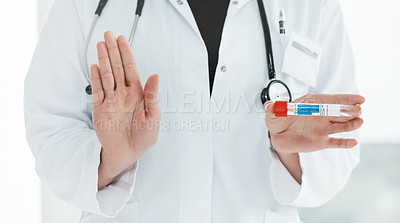 Buy stock photo Cropped shot of a medical practitioner holding up a vial with 