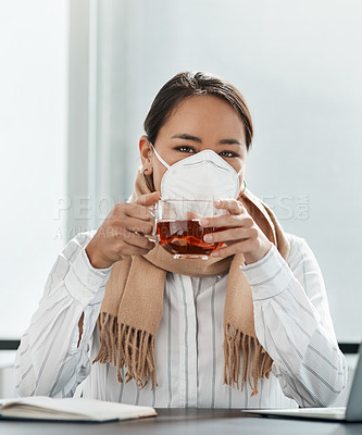 Buy stock photo Shot of a masked young businesswoman having a glass of herbal tea in a modern office