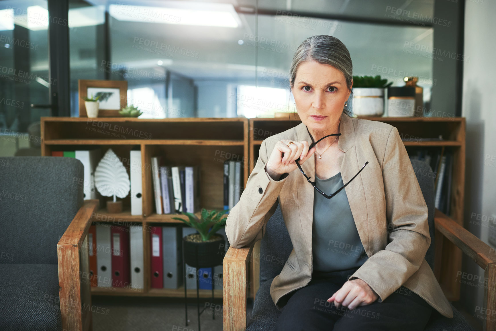 Buy stock photo Portrait of a confident mature psychologist working in a modern office