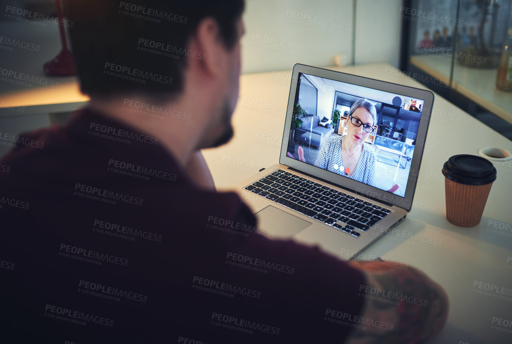 Buy stock photo Shot of a mature psychologist conducting an online therapy session with her patient